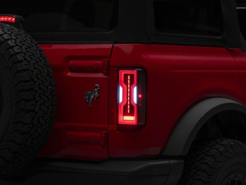 Raxiom 21-26 Ford Bronco Axial Series LED Tail Lights- Black Housing- Smoked Lens