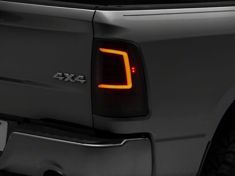 Raxiom 09-18 Dodge RAM 1500 Axial Series LED Tail Lights- Black Housing- Smoked Lens