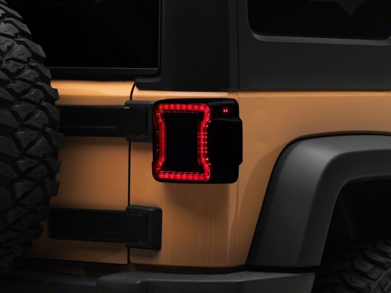 Raxiom 07-18 Jeep Wrangler JK Axial Series JL Style LED Tail Lights- Black Housing- Smoked Lens